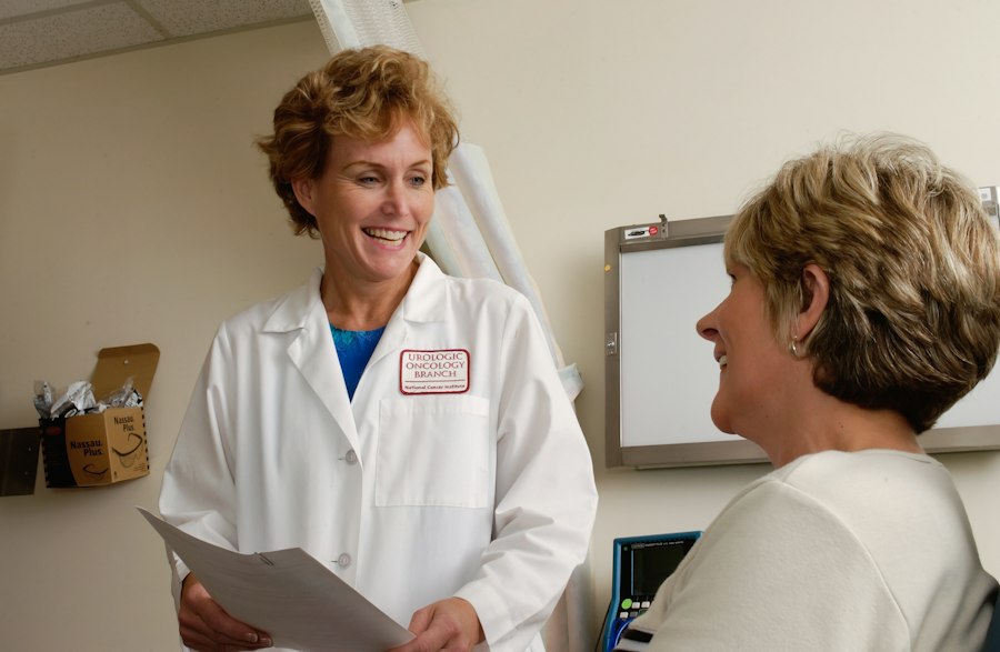 Imaging technologist operating diagnostic equipment